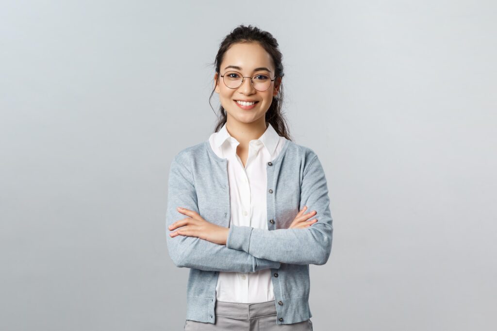 Career, business and education concept. Portrait of cheerful asian girl ready to start online lesson