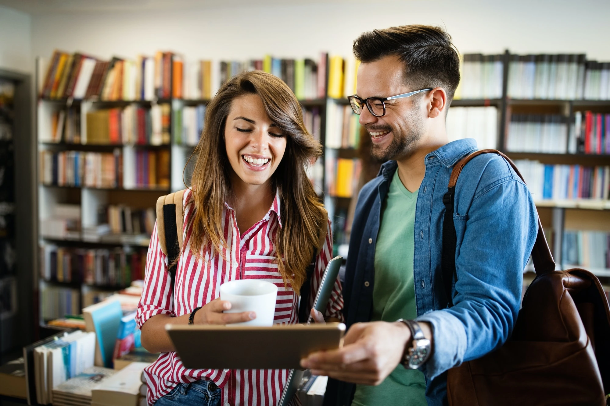 Group of college students studying in the school library