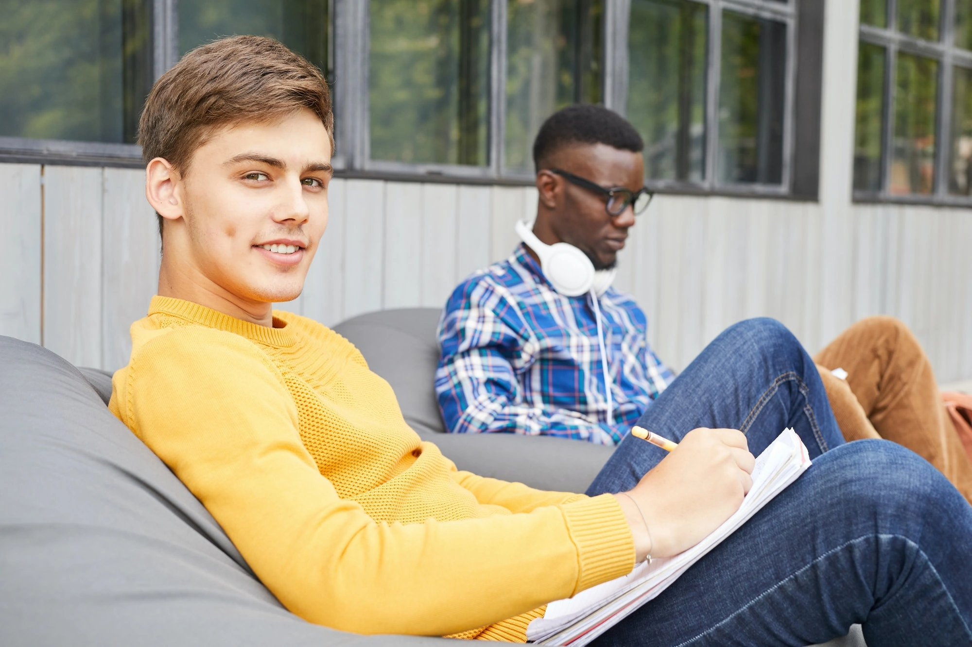 Smiling Student Relaxing Outdoors